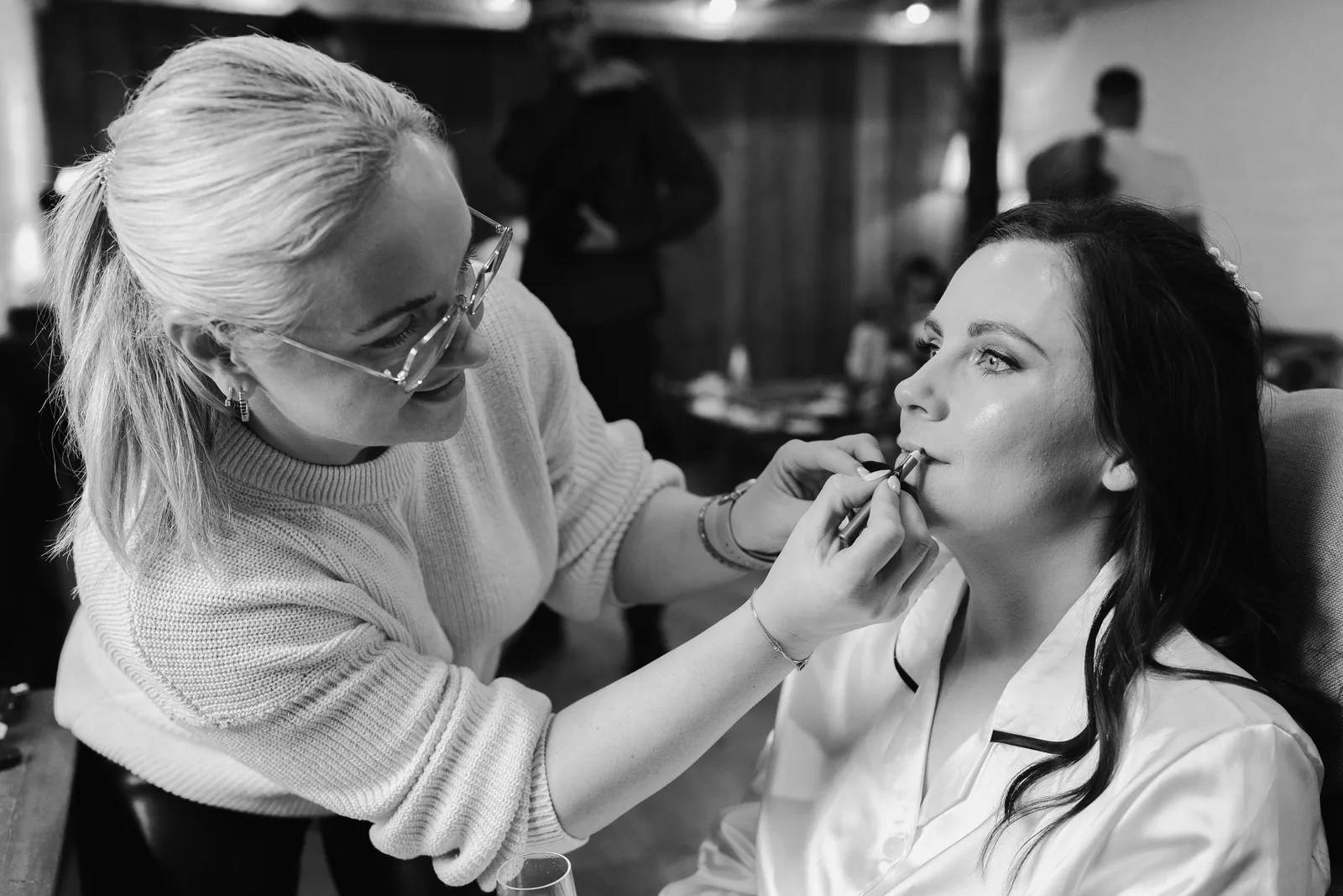 Black and white: Anna lining a client's lips