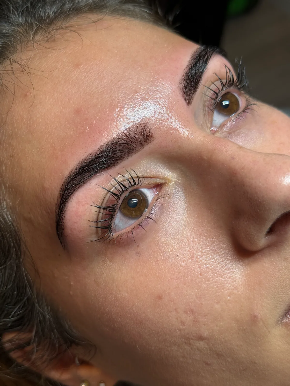 Laminated, tinted brows and lifted lashes, close up