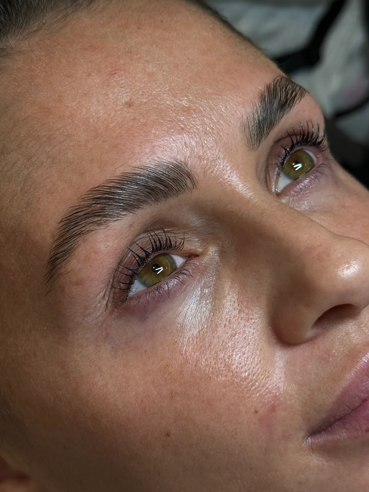 Tinted lashes and shaped brows, close up