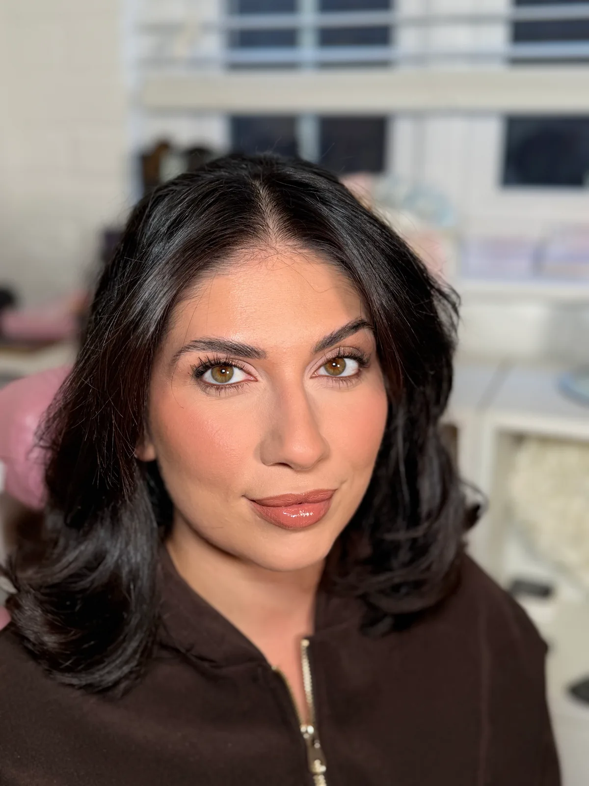 Occasion makeup with sculpted cheeks, defined brows and a nude lip