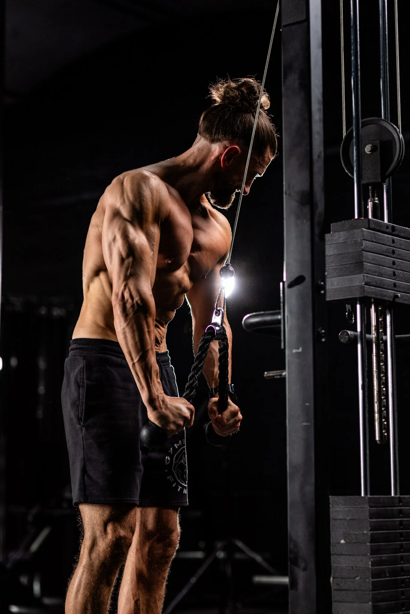 Nick demonstrating a cable exercise in the training studio