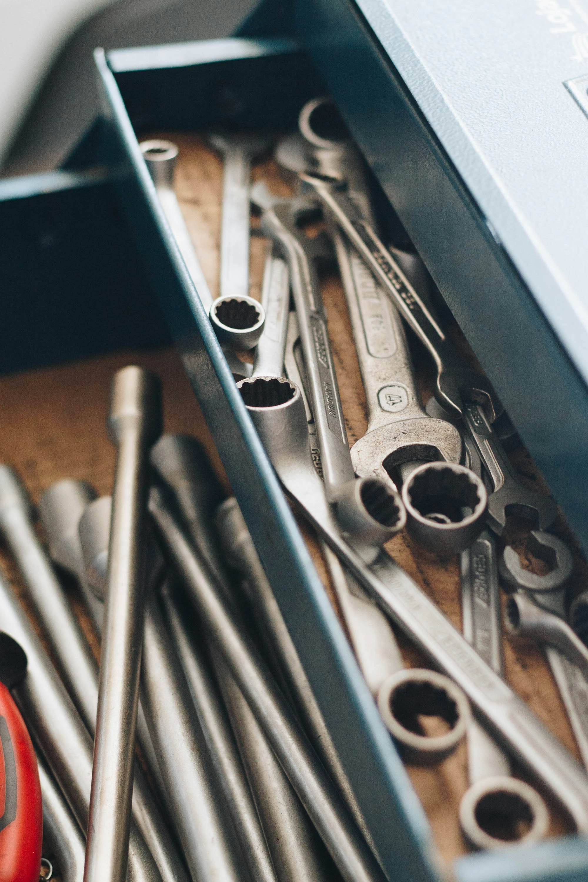 Precision hand tools arranged inside a workshop drawer