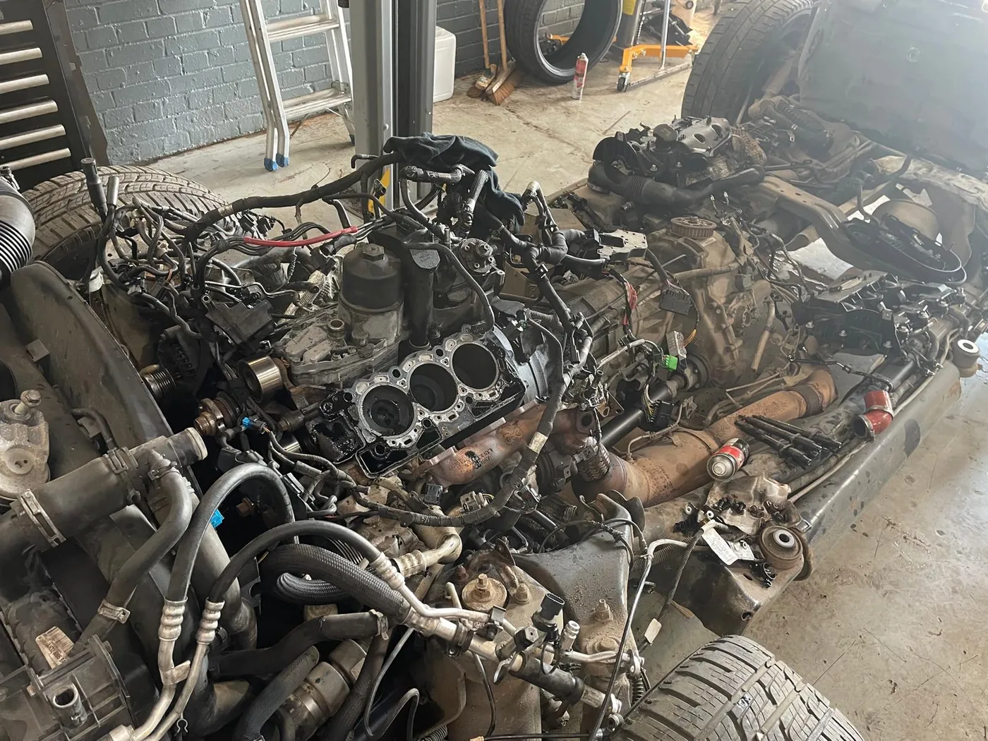 A vehicle stripped down for repair in the workshop