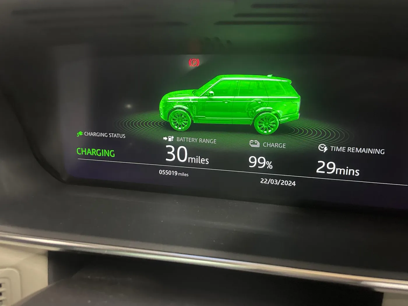 A Range Rover plug-in hybrid dashboard showing charging status