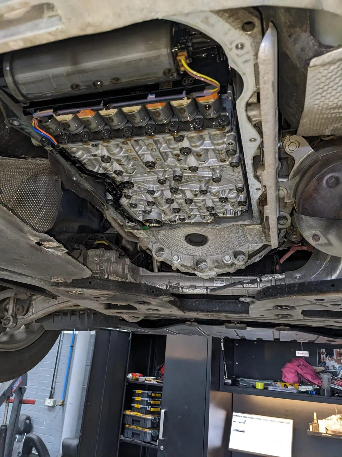 The underside of a vehicle inspected on the lift