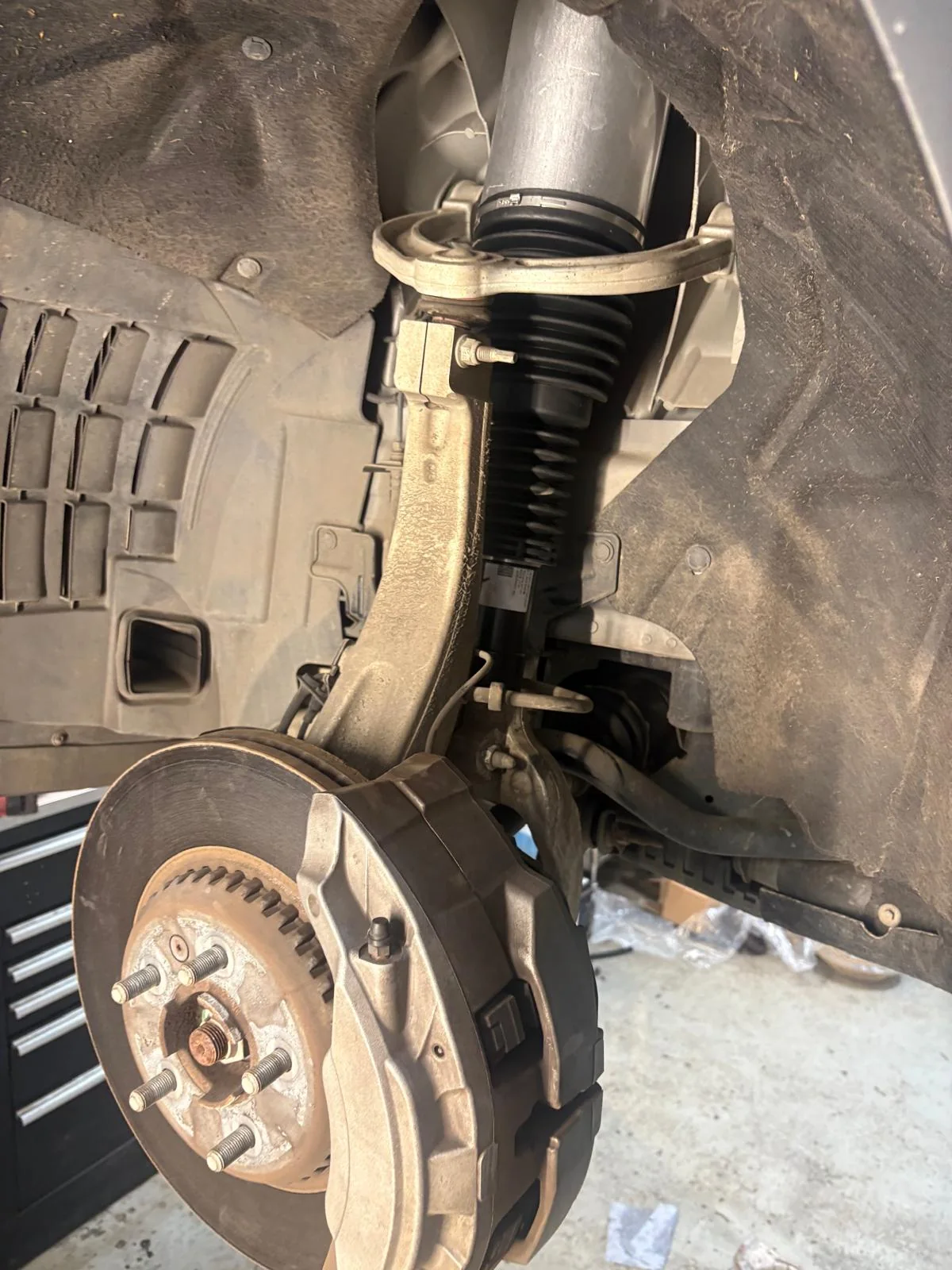 A brake and suspension corner inspected on the lift