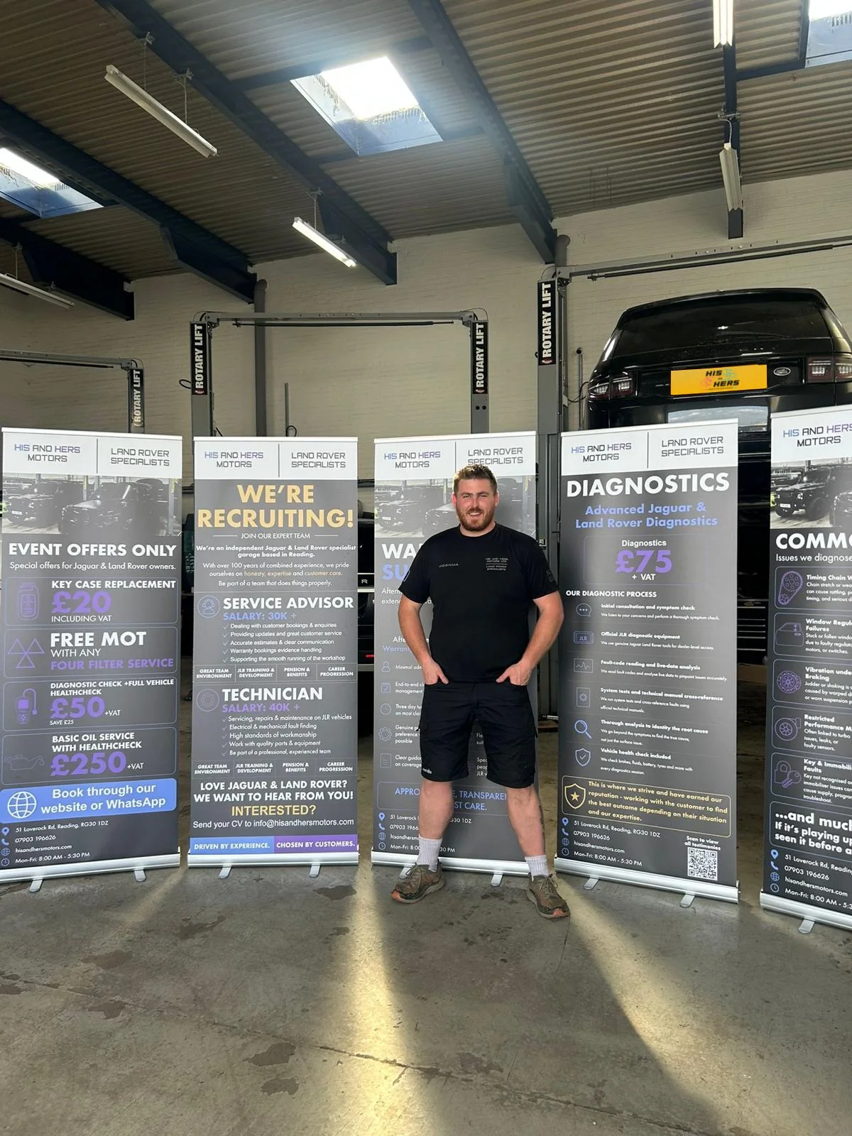Josh standing in the His and Hers Motors workshop
