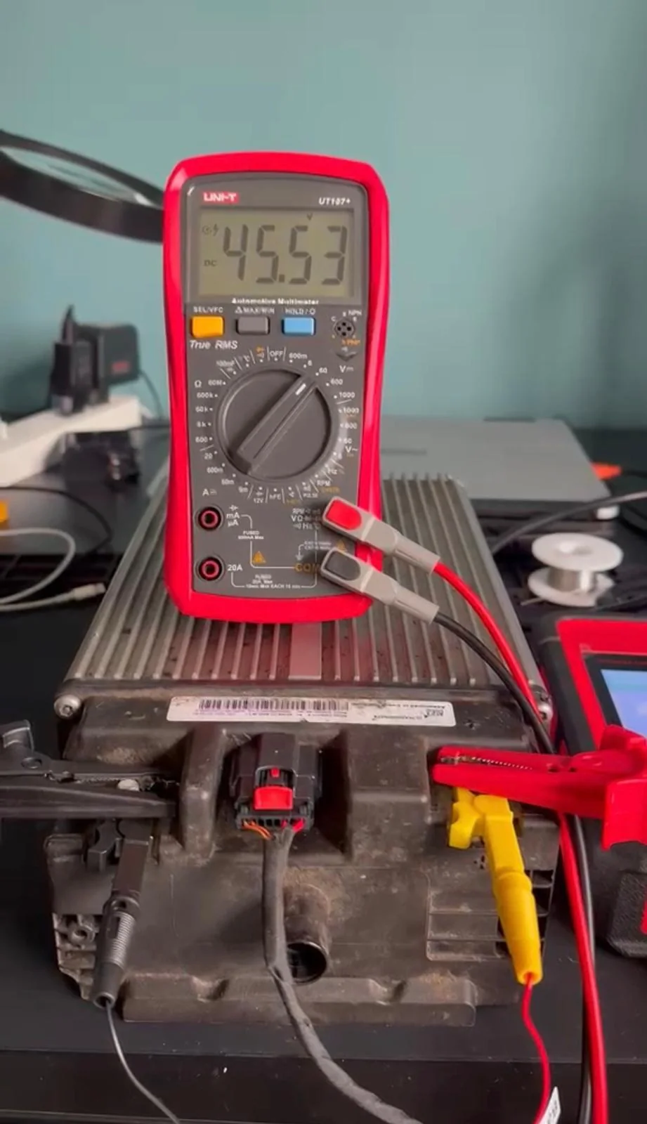 A multimeter testing a vehicle’s electrical system