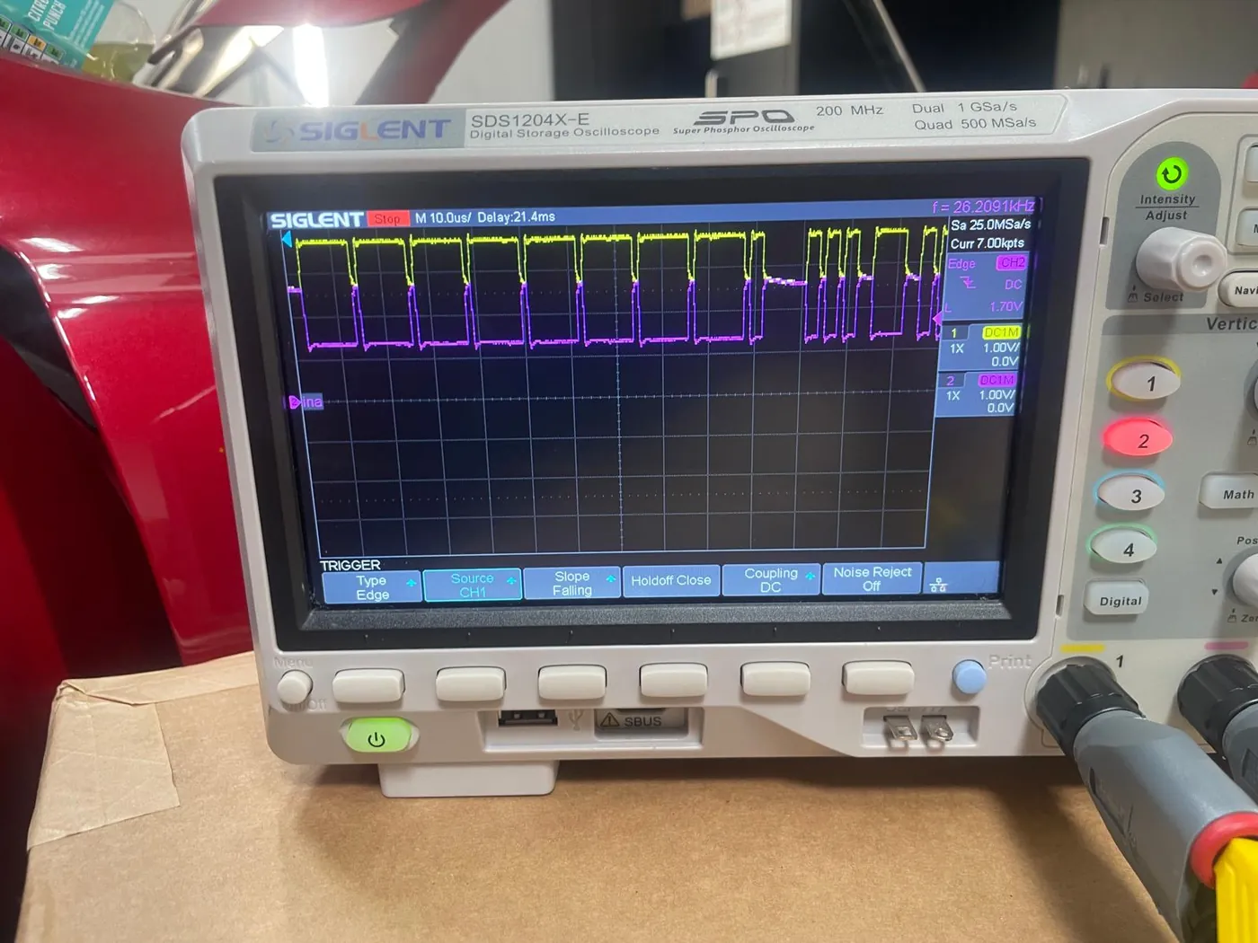 An oscilloscope tracing an electrical signal during diagnosis